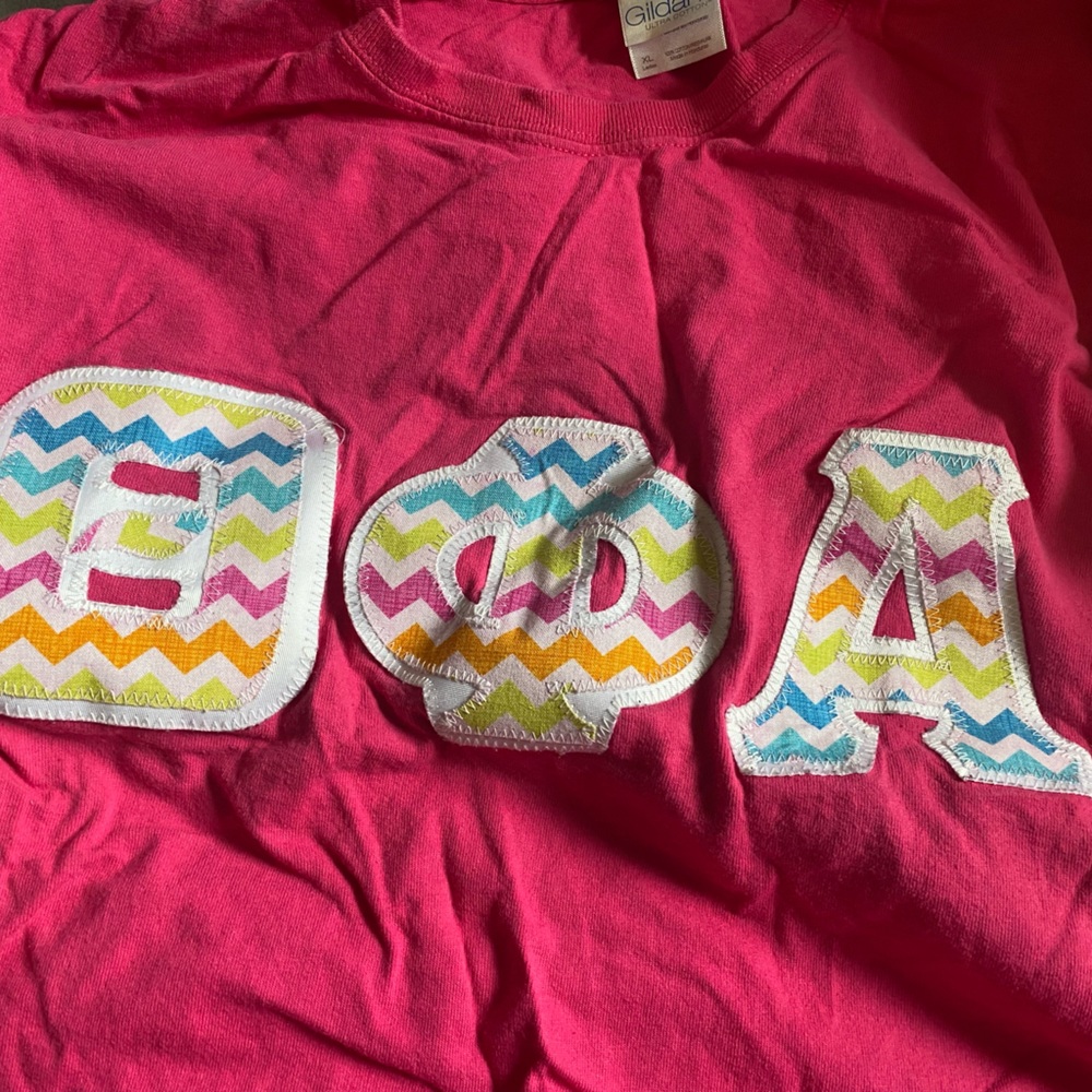 Theta Phi Alpha rainbow stitched letters